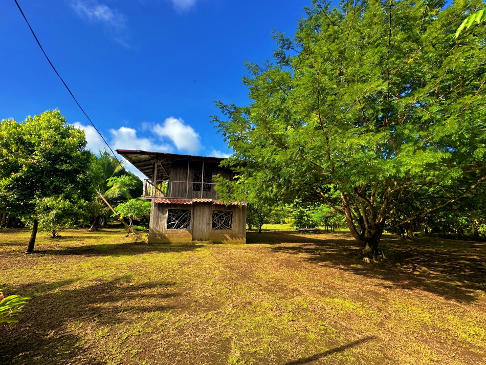 Rustic wooden house on tropical land Pavones Costa Rica