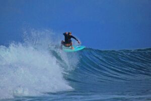 Surfer riding wave in Pavones Costa Rica near Salea – Pavones Real Estate lifestyle